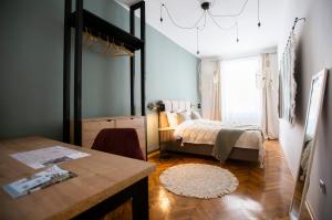 Ένα ή περισσότερα κρεβάτια σε δωμάτιο στο Fusion Apartments