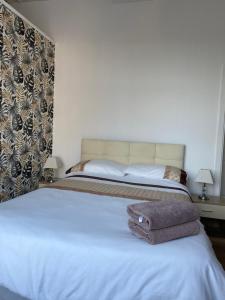 Postel nebo postele na pokoji v ubytování Belhaven Private Hotel