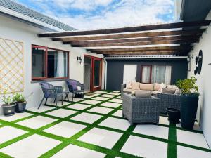 a patio with a green and white checkered floor at Hunters Rest in Hornlee +5 photos