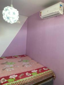 Ένα ή περισσότερα κρεβάτια σε δωμάτιο στο Apartamento Aconchego