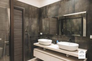 Koupelna v ubytování Archè Rooms and Suites + 22 fotografií