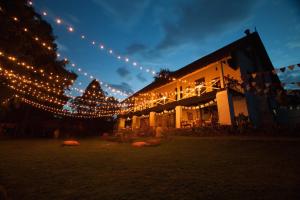 a building with a lot of lights on it at Ngare Sero Mountain Lodge in Usa River