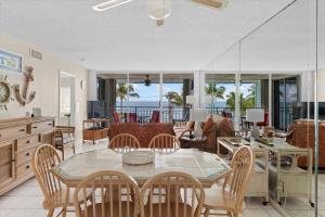 a dining room with a table and chairs at Oceanfront Oasis in Key West