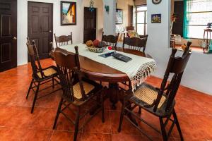a dining room with a table and chairs at Hotel El Patio in Tlacotalpan +21 photos
