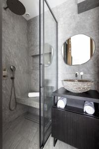 a bathroom with a sink and a mirror at HIGHSTAY - Luxury Serviced Apartments - North Marais 2 in Paris +55 photos