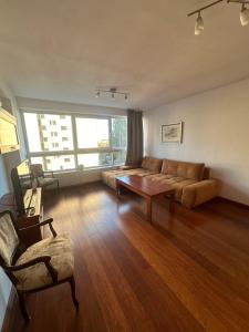 a living room with a couch and a table at Private Apartment Poznań - Free Parking - Netflix in Poznań