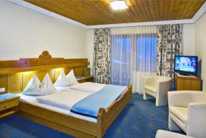 Posteľ alebo postele v izbe v ubytovaní Hotel Berghof
