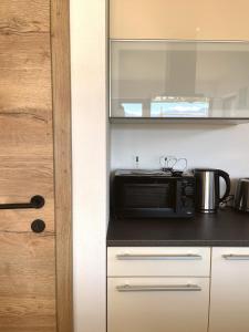 Kuchyň nebo kuchyňský kout v ubytování Ferienwohnung Kühar