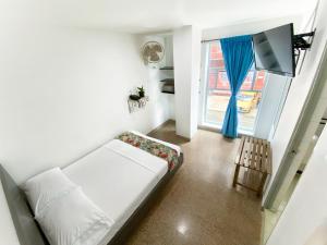 Katil atau katil-katil dalam bilik di Hotel Plaza Mayor Itagui