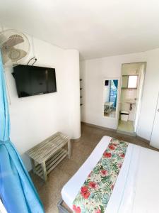 TV a/nebo společenská místnost v ubytování Hotel Plaza Mayor Itagui + 15 fotografií