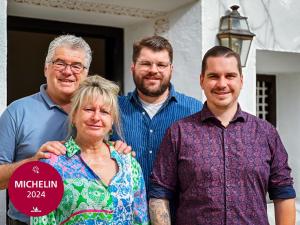a group of people standing in front of a house at Villa Sonnenhof Boutique-Hotel in Bad Reichenhall