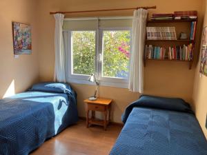 En eller flere senge i et værelse på La casa del pintor