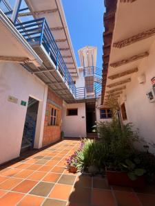 an empty courtyard of a building with stairs and plants at Zana Hotel Boutique in Bogotá +46 photos