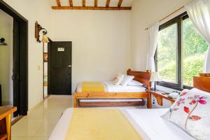 Postel nebo postele na pokoji v ubytování Finca Panaca Herrería 8