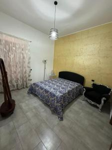 Ένα ή περισσότερα κρεβάτια σε δωμάτιο στο Appartamento Verde MilliGio primo piano +2 φωτογραφίες