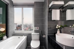 Et badeværelse på Keypad Hotel - Linh Lang