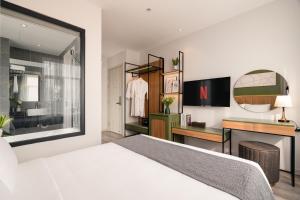 Et tv og/eller underholdning på Keypad Hotel - Linh Lang