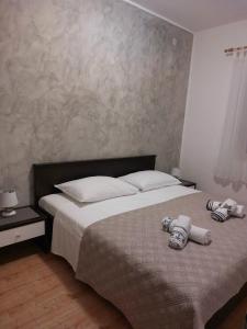Postel nebo postele na pokoji v ubytování Tangerine Apartment