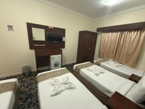 Letto o letti in una camera di فندق غالب المشاعر