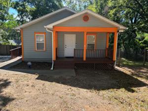 a small house with an orange front porch at Atlanta Cozy Private Room 4 in Atlanta