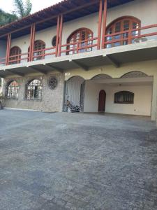 a large building with a balcony on top of it at Casa aluguel de temporada em Florianópolis in Florianópolis