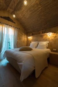 Postel nebo postele na pokoji v ubytování Les Chambres du Vivier, chambres d'hôtes et gîte - à 100m -