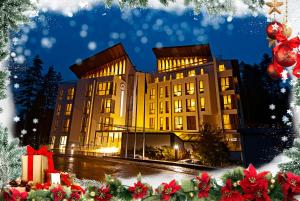 a picture of a building at night with christmas presents at Radina's Way Hotel in Borovets