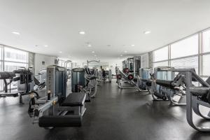 a gym with rows of treadmills and machines at Condominio Premium al Lado de la Plaza Antara Polanco Carso in Mexico City