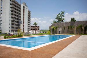 a swimming pool in the middle of a building at Blue Mazatlán in Mazatlán