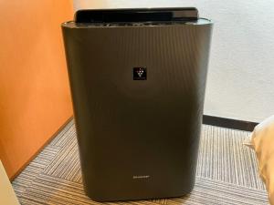 a black cpu is sitting on the floor at Miyakonojo City Hotel - Vacation STAY 15153v in Miyakonozyō +6 photos