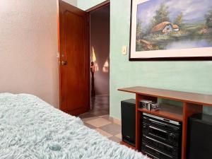 Postel nebo postele na pokoji v ubytování Casa Ortiz