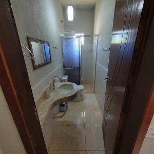 a bathroom with a sink and a shower at Pousada Chapada Equilibrio in Chapada dos Guimarães +37 photos