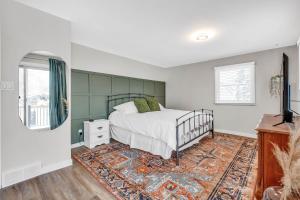 a bedroom with a bed and a rug at Cozy 4 Bedroom Home in Cornwall in Cornwall