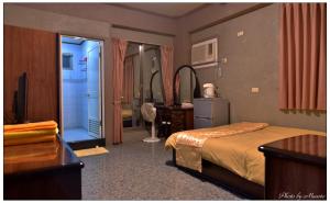 Postel nebo postele na pokoji v ubytování Jheng Tong House