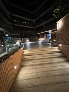 a set of stairs in a building at night at Alba White in Rome
