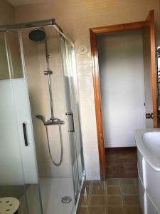 a glass shower in a bathroom with a sink at Piso familiar de 3 hab con Espectaculares vistas in San Vicente de la Barquera