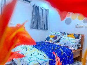 a bedroom with a bed with a cow patterned sheets at Havre de vie in Cocody