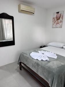Postelja oz. postelje v sobi nastanitve Hotel Naralit