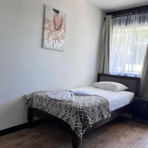 Postelja oz. postelje v sobi nastanitve Hotel Naralit