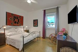 Ένα ή περισσότερα κρεβάτια σε δωμάτιο στο Residence Thalassa With Pool - Happy Rentals