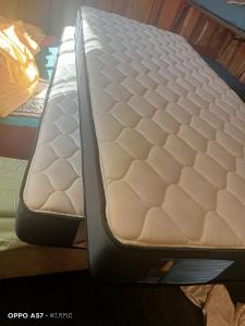 a mattress sitting on top of a bed at Cabaña cunco 6 personas in Cunco