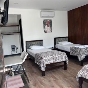 Postelja oz. postelje v sobi nastanitve Hotel Naralit