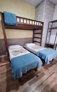 Postel nebo postele na pokoji v ubytování Hospedagem Camisa 10