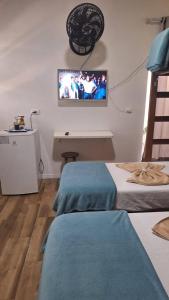 TV a/nebo společenská místnost v ubytování Hospedagem Camisa 10