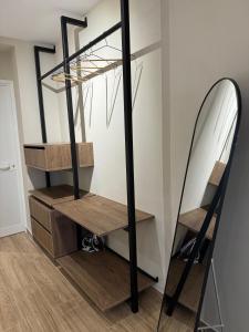 a room with a staircase and a mirror at Nina's Home in Shkodër