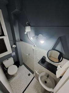 a small bathroom with a sink and a mirror at Flat 776 Cinelândia LAPA VLT Metrô Aeroporto Centro Rio in Rio de Janeiro
