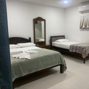 Postelja oz. postelje v sobi nastanitve Hotel Naralit