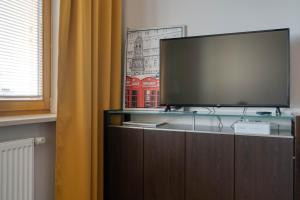 Et tv og/eller underholdning på Airport Residence Amber