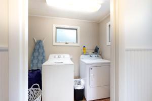 a laundry room with a washer and dryer at Pound House in Hancock +17 photos