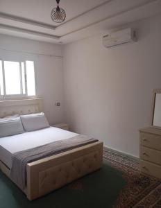 Ένα ή περισσότερα κρεβάτια σε δωμάτιο στο Your House For Family